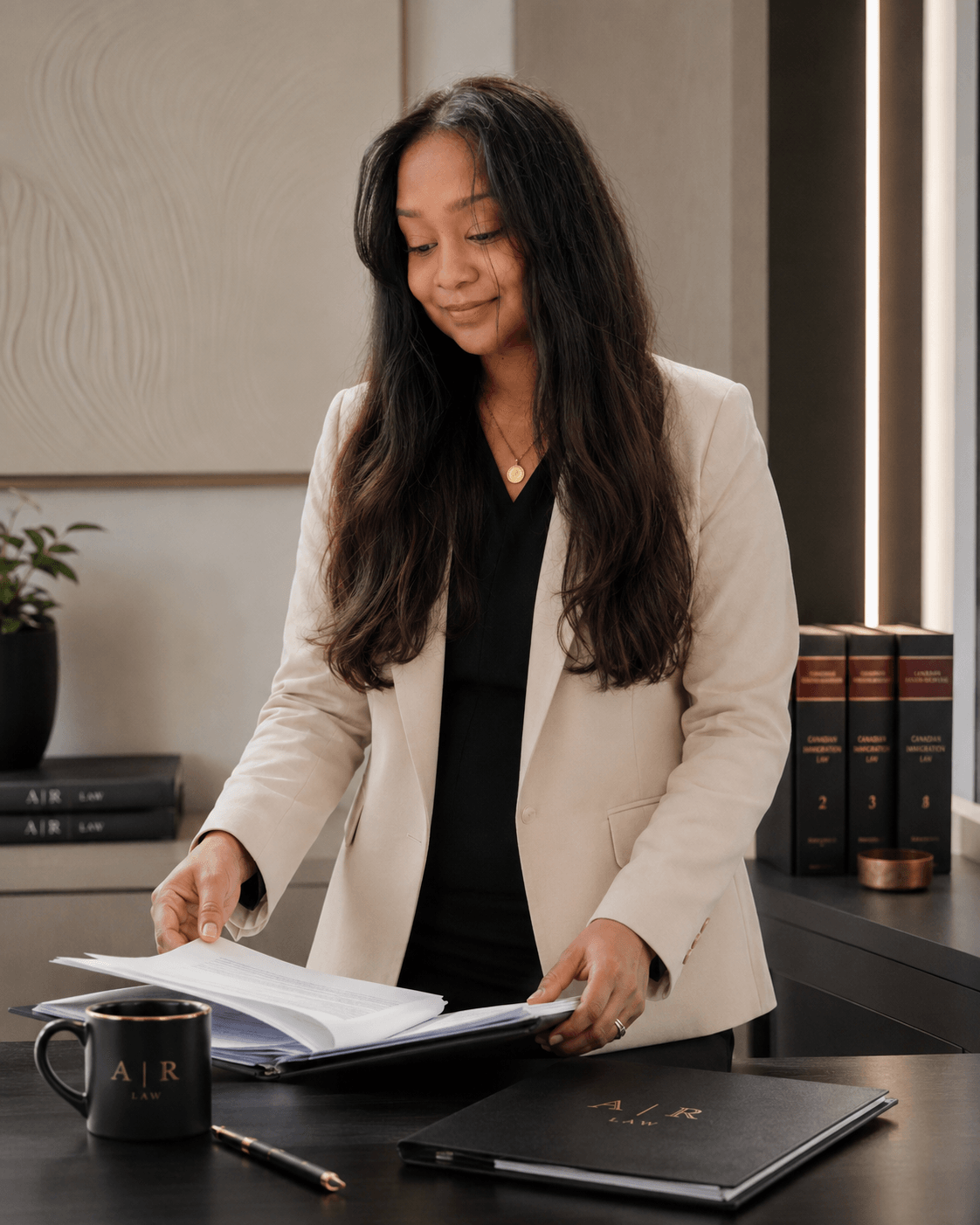 Annie Rupchand, J.D. meticulously reviewing Canadian immigration case files and statutory briefs